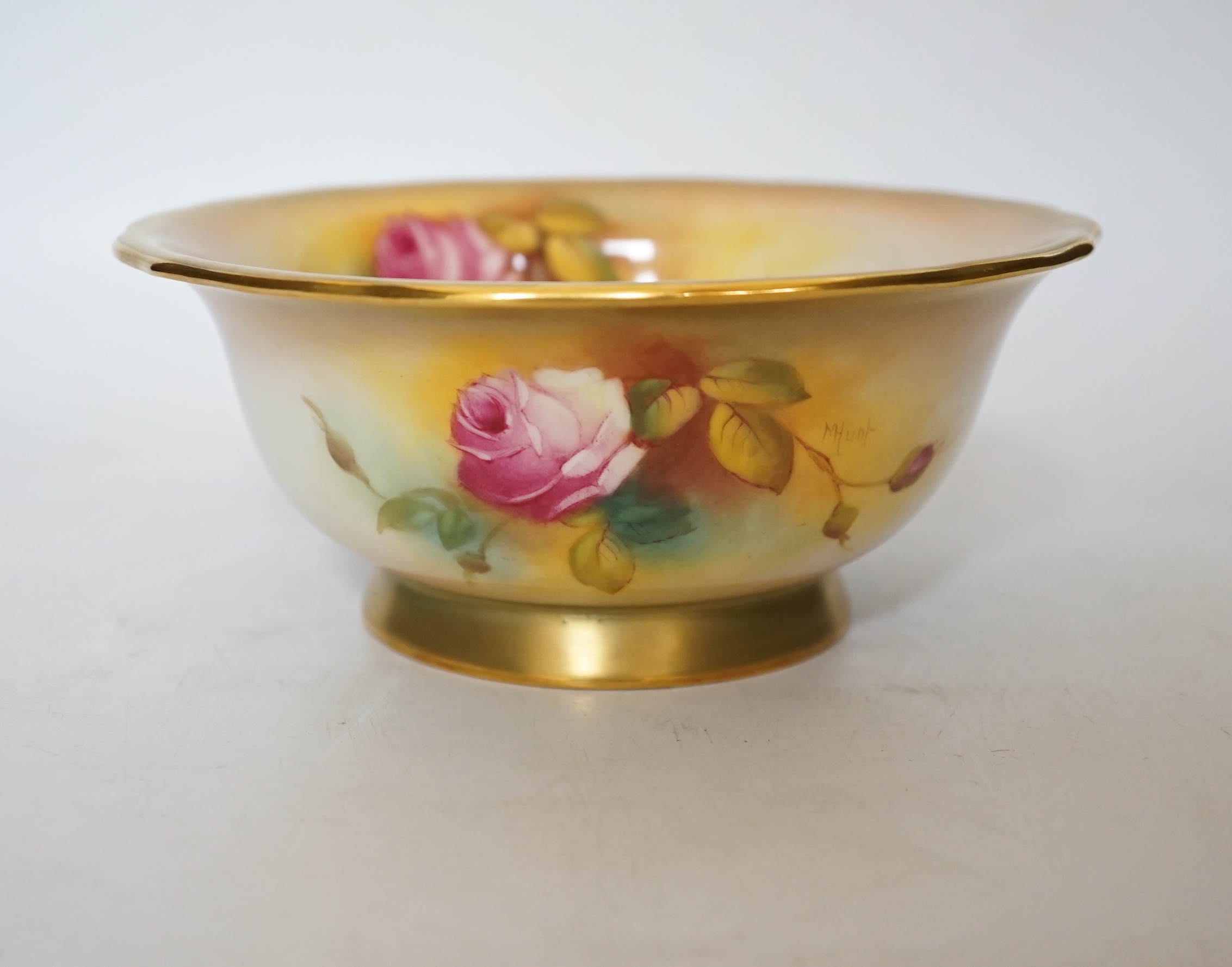 A Royal Worcester bowl decorated with roses, signed M Hunt, 8cm